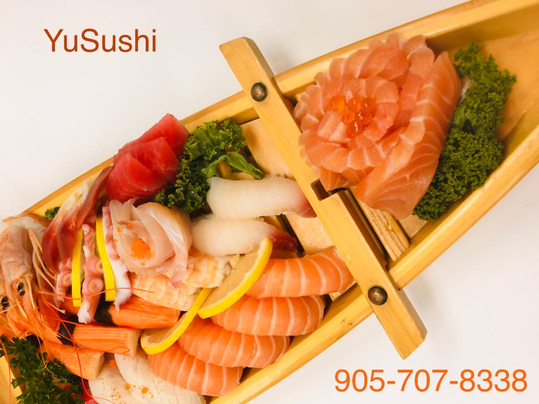 Sushi boat with variety of rolls and nigiri